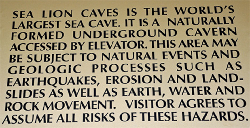 sign by elevator about the cave and elevator